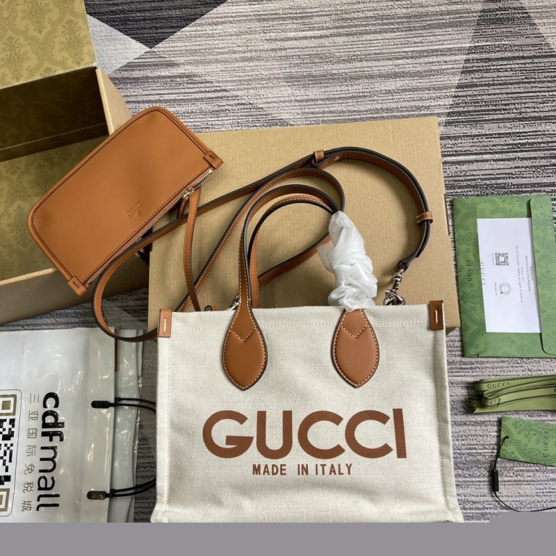 G*u*i shopping bags